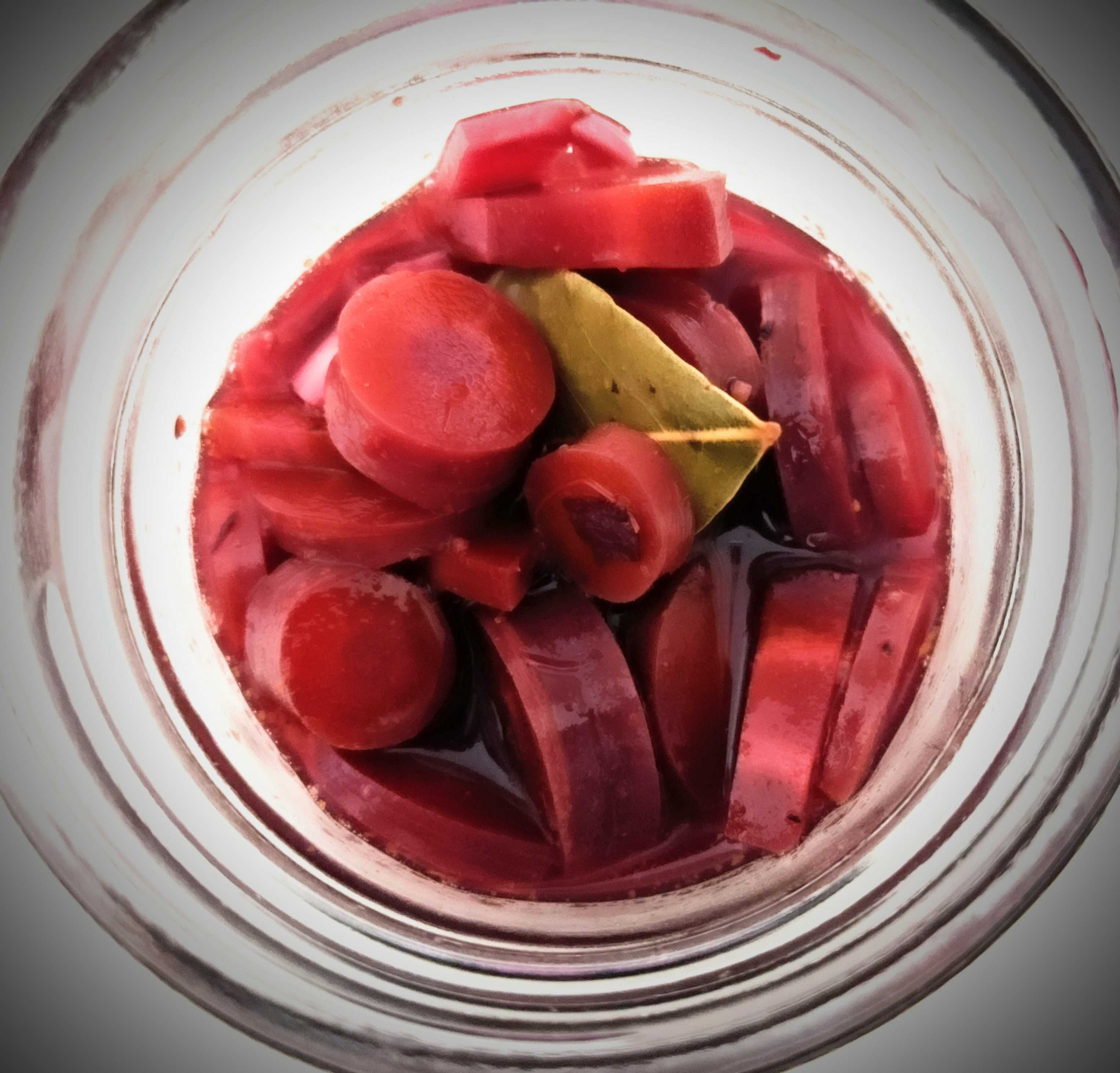 Purple pickled carrots in a jar. They're purple because I used purple carrots to make the pickles. I didn't use beet juice the way some people do to make things purple, because I like things that taste good, and beet juice is the opposite of that.
